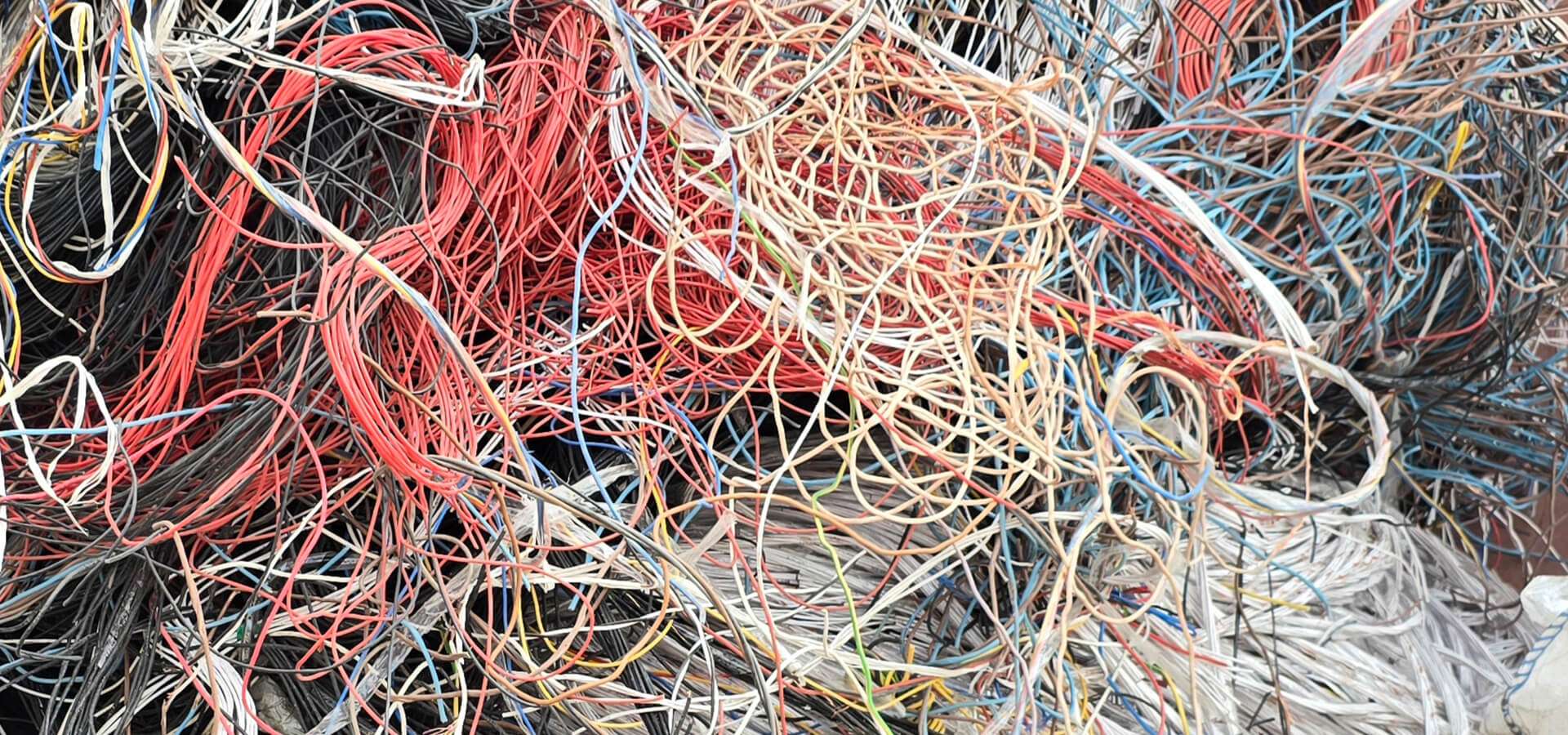 Coils of copper cable and wire scrap bought by scrap dealers in Ajman