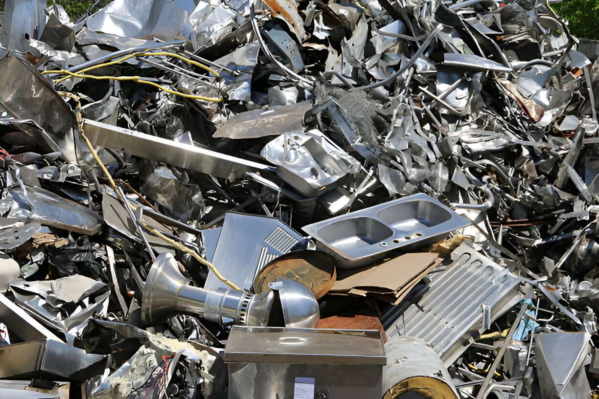 Mixed ferrous and non-ferrous metal scrap ready for grading, handled by scrap dealers in Umm Al Quwain